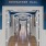 a hallway with blue walls and wood floors