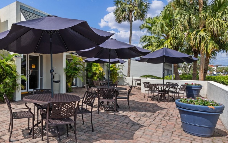 outdoor patio area with seating and umbrellas