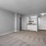 living area with carpet and grey walls