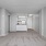 living area with carpet and grey walls