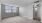 living room with large windows and carpet