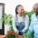 a man and a woman smiling while gardening