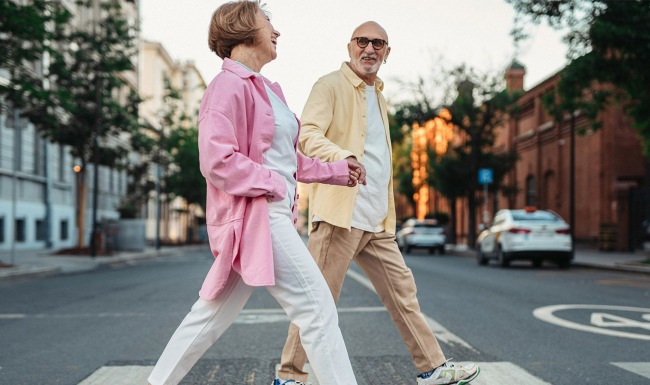 man and woman walking through the city