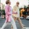 man and woman walking through the city