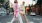 man and woman walking through the city